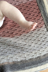 baby foot with almond stitch preemie baby blanket crochet in background thumbnail