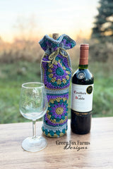 wine glass, wine bag, and a bottle of wine on a table  thumbnail