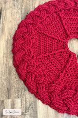 close up of handmade red and white cable braid crochet Christmas tree skirt thumbnail