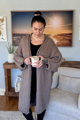 another front view of cardigan with woman holding coffee thumbnail