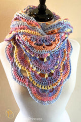 pastel virus stitch crochet shawl displayed on a mannequin with multicolor yarn thumbnail
