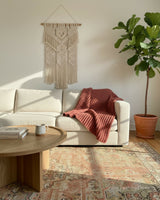 dusty pink knitted mistake rib throw blanket draped on furniture thumbnail