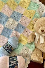 Crochet Blanket Beside A Teddy Bear thumbnail
