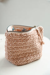 Pale pink bag open to show lining thumbnail