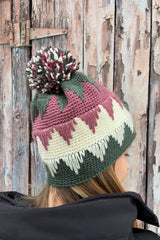 Back view of hat in green, pink, and cream with triangular design in spike stitch.  thumbnail