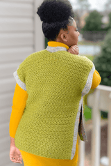 Back view of green vest, worn by woman on front porch.  thumbnail