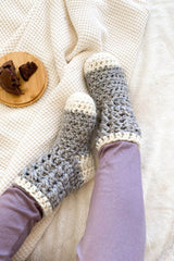Model wearing lavender leggings and crochet slipper sock in grey and cream.  thumbnail