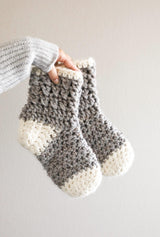 Crochet socks in grey with cream cuffs, heels, and toes.  thumbnail