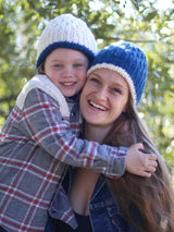 Woman and child wearing coordinating crochet hats with inverse colors.  thumbnail