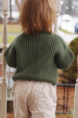 Back view of green crochet sweater, in rib texture, on toddler.  thumbnail