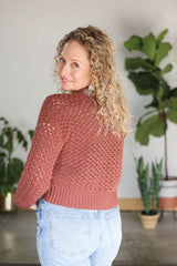 Back view of crochet mesh cardigan, with ribbed waistband.  thumbnail