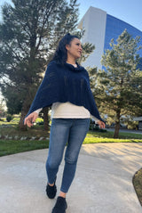 Navy cable knit poncho worn with points going over shoulders, so front edge is straight.  thumbnail