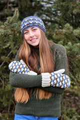 Womand with crossed arms wears crocheted mittens with cream cuff and thumbs and matching headband.  thumbnail