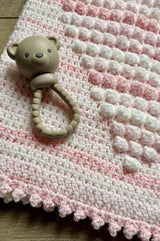 Close up of border and popcorn stitches on crochet baby blanket.  thumbnail