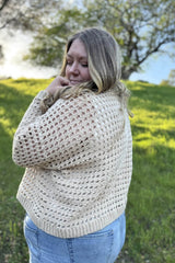 Side view of crochet mesh pullover, showing drop shoulder construction. thumbnail