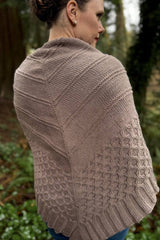Back view of knit shawl with ridges in the upper part and a deep cabled border, made in warm taupe.  thumbnail
