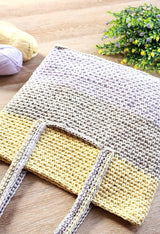 Front view of bag laid on table, showing pocket opening on front.  thumbnail