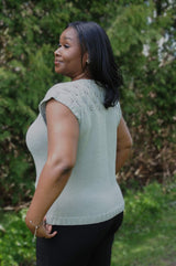 Side view of knit tee, showing lave yoke on front and back, and ribbed trim.  thumbnail