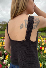 Side back view of crochet tank top showing straight back top, medium width straps, and eyelet detail around edging.  thumbnail