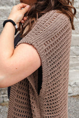 Side view of knit sleeveless cardigan. It's knit in a taupe color with all over eyelets thumbnail