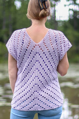 Back view of crochet top with an arrow design of open spaces in a solid design The top is pale purple.  thumbnail