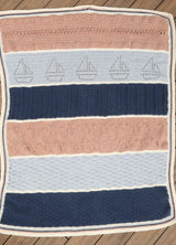 Full top town view of crochet blanket worked in sections of different colors and textures.  thumbnail