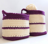 Angled front view of crochet baskets, showing textured bands around basket body and scalloped edge around top opening.  thumbnail