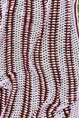 Top down view of textured & striped afghan.  thumbnail