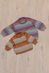 Flat lay photo of two child's sweaters lad on a wooden floor. Both have blocks of stripes, with the larger sweater knit in a muted rainbow and the smaller sweater knit in warm fall colors.  thumbnail