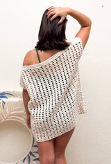 Back view of woman wearing a white crochet mesh cover-up.  thumbnail