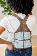 Back view of vest showing racerback style, with straps meeting between the shoulders and connecting to a triangular panel.  thumbnail