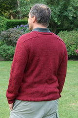 Back view of knit sweater on adult man, showing saddle shoulder construction.  thumbnail