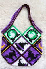 Flat lay of Halloween patchwork bag laid on cream rug.  thumbnail