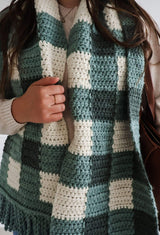 Close up of scarf being worn, showing large scale gingham design.  thumbnail