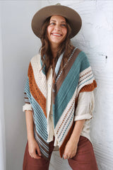 Cropped front view of large triangular crochet shawl draped over shoulders, with points hanging below waist.  thumbnail