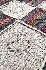 Close up of linen stitch square with embroidered heart motif.  thumbnail