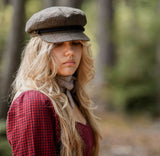 Woman wearing knit scarf in woods thumbnail