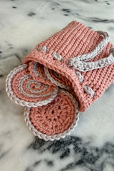 Crocheted face rounds with bag on counter thumbnail
