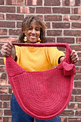 woman holding crochet bag thumbnail