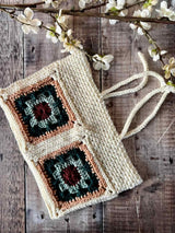 handmade crochet hearthside book sleeve on a wooden surface thumbnail