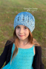 elixir beanie featuring blue ombre mandala yarn crocheted in a textured stitch pattern on girl thumbnail