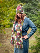 woman wearing crochet scarf and hat in the woods thumbnail