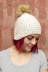 White hat with pom thumbnail