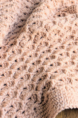 close-up of pink crochet blanket thumbnail
