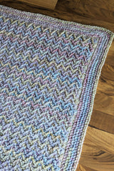 close-up of corner of crochet blanket with textured herringbone stitch thumbnail