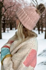side view pink crochet hat with fur pom pom thumbnail