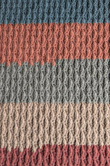 Close-up of striped crochet blanket thumbnail