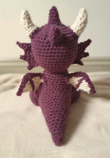 crochet amigurumi stuffed animal of a dragon back view thumbnail