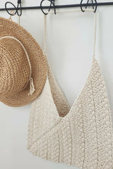 ecru bag hanging next to hat on rack thumbnail