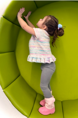 Little girl in knit top playing thumbnail